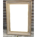 A modern wall mirror with rectangular plate, in gilt and moulded Arquadia frame.