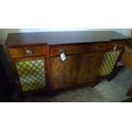 A large 20th century sideboard, flame mahogany veneered with three drawers above three cupboards, br... 