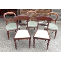 A set of six Victorian mahogany bar back dining chairs, with carved mid rail and green drop in seats... 