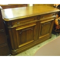 A modern oak veneered side board, two drawers, two cupboards, ring handles.
