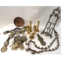 A group of brass items, comprising a easel picture display frame, set of sleigh bells on leather str... 