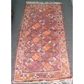 A small Tekke rug with red ground, eight and a half rows of three guls, orange, brown, cream and dar... 
