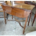 An early 19th century mahogany and inlaid side table, with rectangular surface with shaped drop leav... 