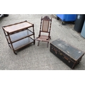 A group of furniture, comprising a three tier tea trolley, a folding campaign style low chair with c... 