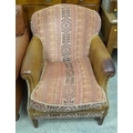 A modern brown leather and fabric armchair, metal studded ends to scroll arms, red, brown, cream fab... 