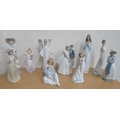 A collection of Nao figurines, including 'The Greatest Bond' and 'Unforgettable Dance' figures. (1 b... 
