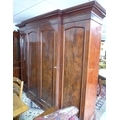 A Victorian mahogany break front wardrobe, four full length doors, the central pair opening to revea... 