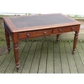 A Victorian mahogany library table / desk, inset dark brown cloth surface, moulded edges, two frieze... 