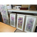 A group of prints, comprising of three silver framed floral prints and one floral picture on a large... 