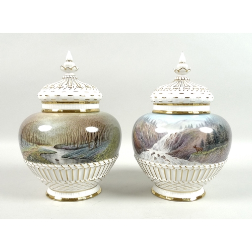 56 - A pair of modern Royal Worcester potpourri vases and pierced covers, decorated by M. Powell in ‘Spri... 