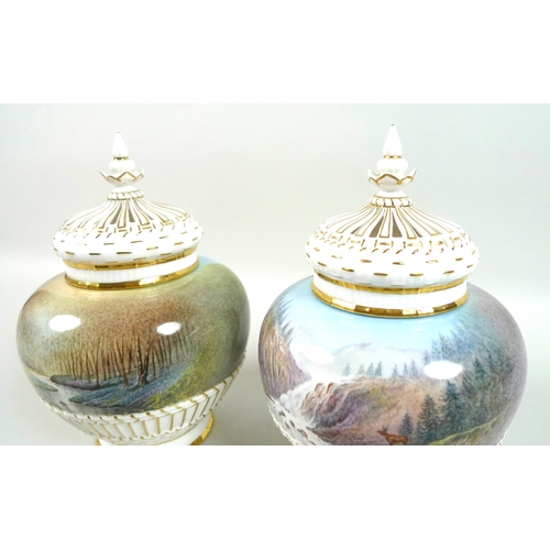 56 - A pair of modern Royal Worcester potpourri vases and pierced covers, decorated by M. Powell in ‘Spri... 