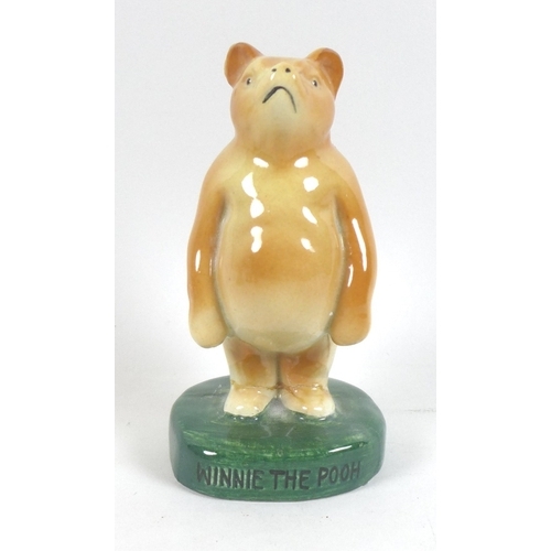 4 - A rare group of six Fulham Pottery Winnie-the-Pooh figurines, mid 20th century, modelled as Winnie T... 