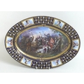 A 19th century Sevres style porcelain oval dish, decorated with a central reserve depicting the batt... 