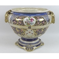 A Continental porcelain jardiniere, 19th century, possibly Samson of Paris, with twin ram's head han... 