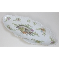 A Continental porcelain fish platter, of twin handled oval form, decorated with fish, mussels, prawn... 