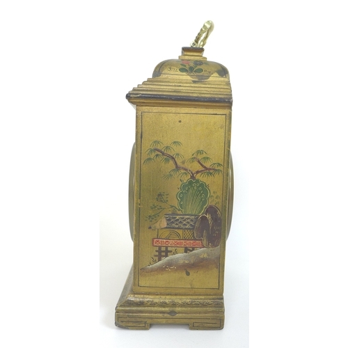 79 - A 20th century mantel clock, Chinoiserie decorated against a gold ground, the white dial with black ... 