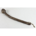 An early 19th century Irish bog oak shillelagh, with bulbous club end, curved handle and string atta... 