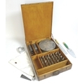 A 1940s cake decorators set in fitted wooden case, with Tala branded bag, various nozzles, metal laz... 