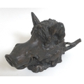 A bronze inkwell in the form of a boar's head, hinged opening to reveal a ceramic bowl.