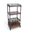 A Victorian rosewood whatnot with Canterbury base, of three tiers, three quarter gallery with turned... 