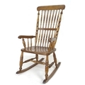 A Victorian elm stick back rocking chair, with turned H stretcher, 56 by 70 by 107cm high.