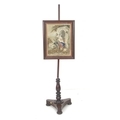 A Victorian mahogany pole screen, with rectangular panel set with embroidery of a hunter courting a ... 