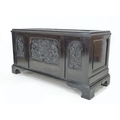 An early 20th century ebonised chest, in the manner of Collinson & Lock, the lid and front panels fi... 