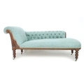 A late Victorian mahogany chaise longue, with scroll end and carved decoration, buttoned arm, uphols... 