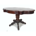 A Victorian mahogany veneered centre table, the shaped surface with moulded edge, two frieze drawers... 