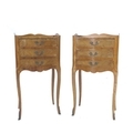 A pair of French Louis XVI style bedside cabinets, marquetry veneered, each with single door, cabrio... 