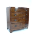 A Regency mahogany chest of drawers, ebony strung and bowfronted, bracket feet, 99.5 by 55 by 104cm ... 