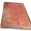 A Persian Ushak carpet with red ground, field decorated with blue and orange flower motifs, multiple... 