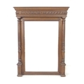 An Edwardian overmantel mirror, with bevelled rectangular plate, architectural oak frame with turned... 