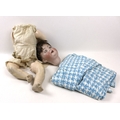 An early 20th century German bisque headed doll, dis-assembled, the eyes currently moving both up an... 