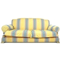 A modern three seater sofa with brass feet, yellow cotton upholstered with striped detailing, 200 by... 