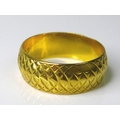 A 22ct gold textured band, size K/L, 5.5g.