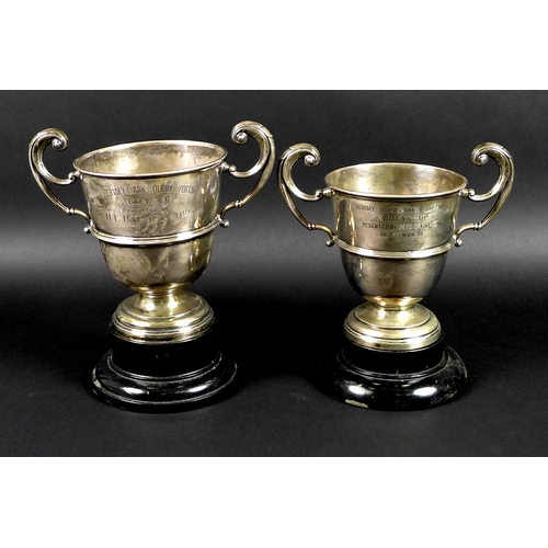 30 - Two George V silver twin handled trophies, the first engraved 'Chertsey August Bank Holiday Sports, ... 
