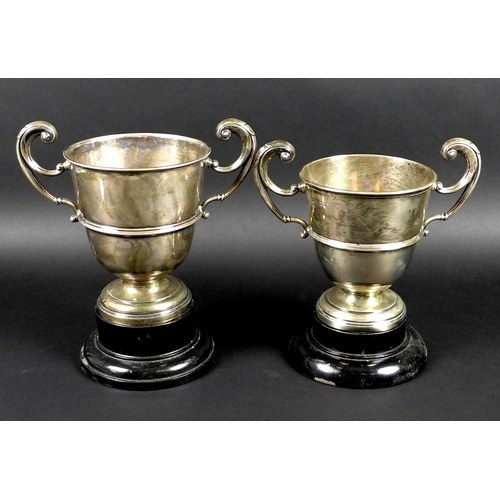 30 - Two George V silver twin handled trophies, the first engraved 'Chertsey August Bank Holiday Sports, ... 