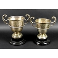 Two George V silver twin handled trophies, the first engraved 'Chertsey August Bank Holiday Sports, ... 