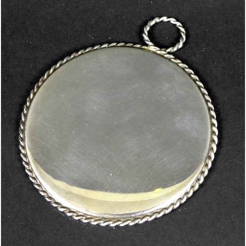 11 - A mid 20th century Tiffany and Co hand mirror with rope twist rim, marked Sterling near handle, 7.2c... 