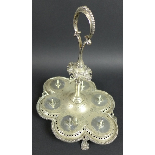29 - A Victorian silver egg cup stand with six egg cups, raised scroll form handle, all with pierced and ... 