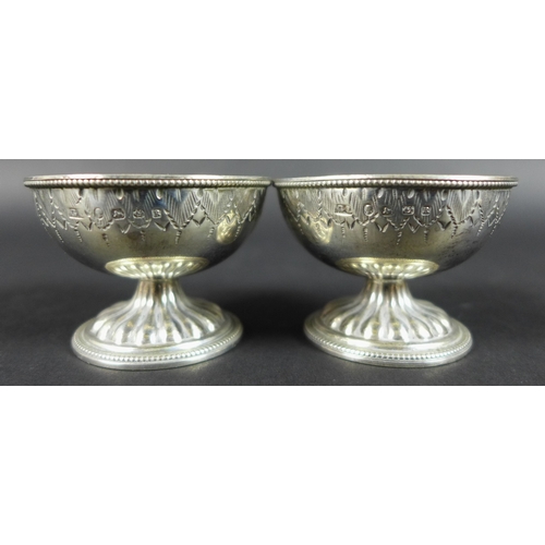 24 - A pair of Victorian silver salts, possibly George Unite and Sons, Birmingham 1866, together with a p... 