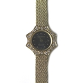 A Longines 18ct gold cocktail watch, circa 1980, scalloped diamond set bezel, circular black dial wi... 