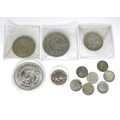 A group of silver coins comprising an 1886 silver Morgan dollar, an 1896 silver Morgan dollar, a 193... 