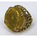 An Edward VII gold half sovereign, 1906, in a 9ct gold ring setting, size N, 10.5g total.