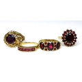 Private Collection-Vintage and Modern design rings: A group of four 9ct gold and garnet rings, compr... 