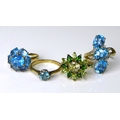 Private Collection-Vintage and Modern design rings: Four 9ct gold rings set with blue and green gems... 