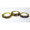 Private Collection-Vintage and Modern design rings: Three 9ct gold bands with multicoloured gemstone... 