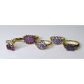 Private Collection-Vintage and Modern design rings: A group of 9ct gold rings set with purple stones... 