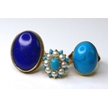 Private Collection-Vintage and Modern design rings: A group of three 9ct gold and polished gemstone ... 